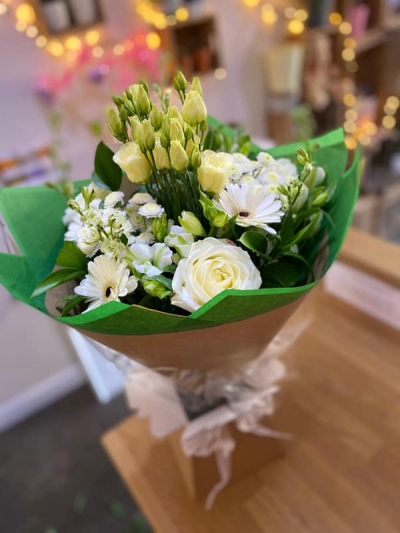 Always Classy - A beautiful handtied in water presented in a gift box , created using the fresh blooms of the day in all white with complementary foliage.